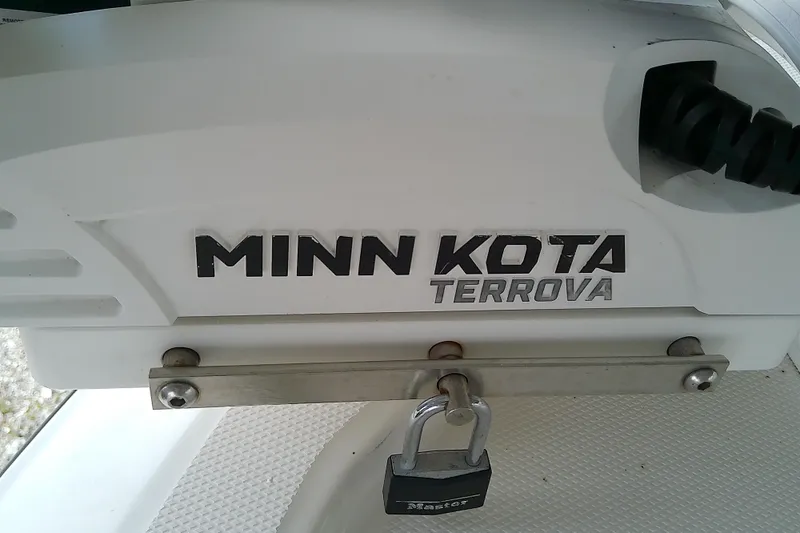 Slide: The Image of Minn Kota Terrova motor on 2022 Sea Cat 260 boat, secured with a padlock. - 31