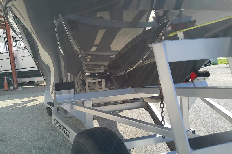 Slide: The Image of 2022 Sea Cat 260 boat on Sport Trail trailer, showcasing hull and trailer details. - 9