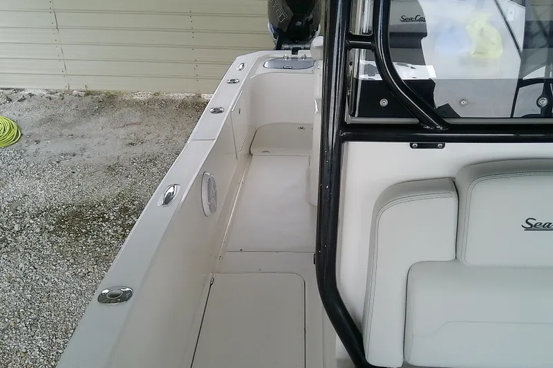 Slide: The Image of 2022 Sea Cat 260 boat interior with seating and storage compartments. - 42