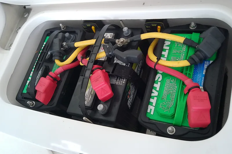 Slide: The Image of Battery compartment of a 2022 Sea Cat 260 boat with Interstate batteries. - 46