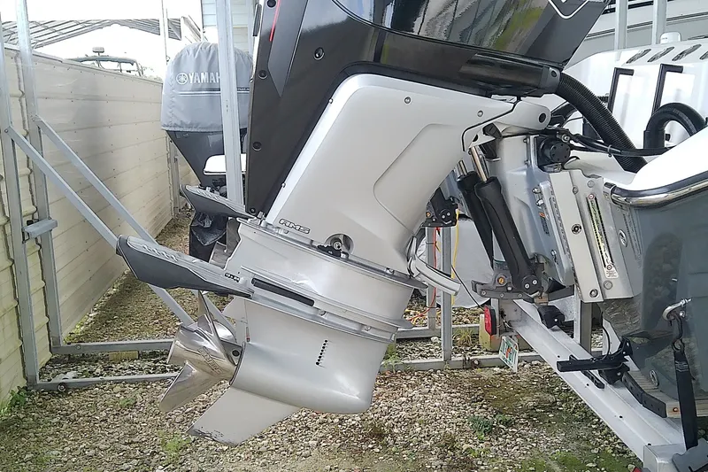 Slide: The Image of An outboard motor on a boat, featuring a propeller and sturdy mounting mechanism. - 13