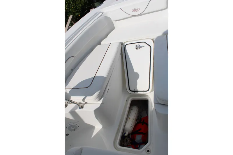 Slide: The Image of 2019 Sea Hunt Gamefish 25 boat interior with storage compartments and seating. - 13