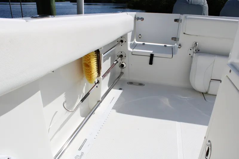 Slide: The Image of 2019 Sea Hunt Gamefish 25 boat interior with storage and seating features. - 27