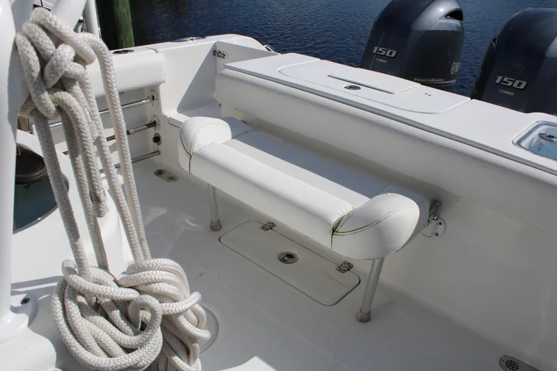 Slide: The Image of 2019 Sea Hunt Gamefish 25 boat interior with seating and twin Yamaha 150 engines. - 36