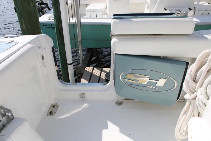 Slide: The Image of 2019 Sea Hunt Gamefish 25 boat interior with SH logo and coiled rope. - 34