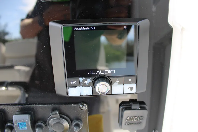 Slide: The Image of JL Audio MediaMaster 50 on 2019 Sea Hunt Gamefish 25 boat dashboard. - 19