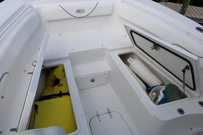 Slide: The Image of 2019 Sea Hunt Gamefish 25 boat storage compartments with safety gear and supplies. - 7