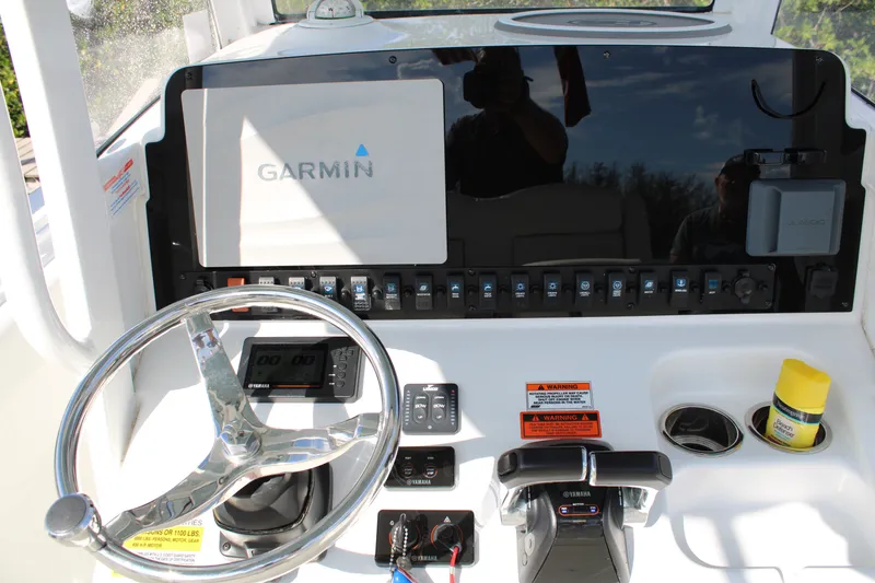 Slide: The Image of 2019 Sea Hunt Gamefish 25 helm with Garmin display and Yamaha controls. - 21