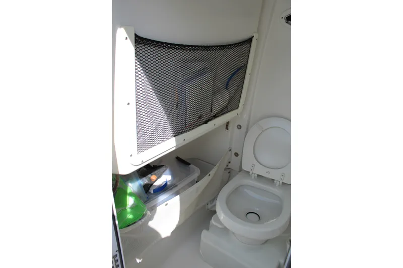 Slide: The Image of 2019 Sea Hunt Gamefish 25 boat interior with toilet and storage net. - 41