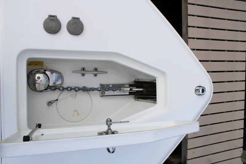 Slide: The Image of Anchor locker of 2019 Sea Hunt Gamefish 25 boat, featuring chain and winch system. - 9
