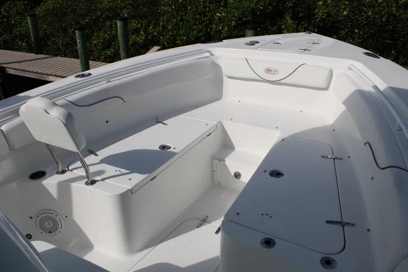Slide: The Image of 2019 Sea Hunt Gamefish 25 boat interior with seating and storage compartments. - 6