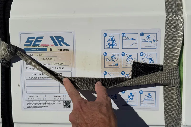 Slide: The Image of 8 person Life Raft secured on the forward deck. Still under certification. - 26