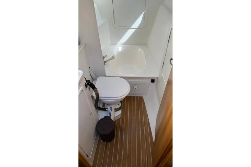 Slide: The Image of Forward head with toilet and shower/tub combo. - 16