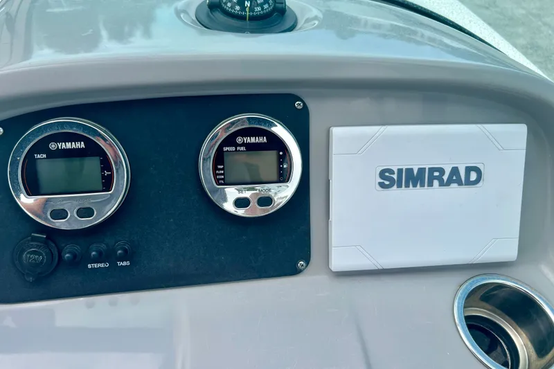 Slide: The Image of Dashboard of 2024 Robalo R207 Dual Console with Yamaha gauges and Simrad display. - 13