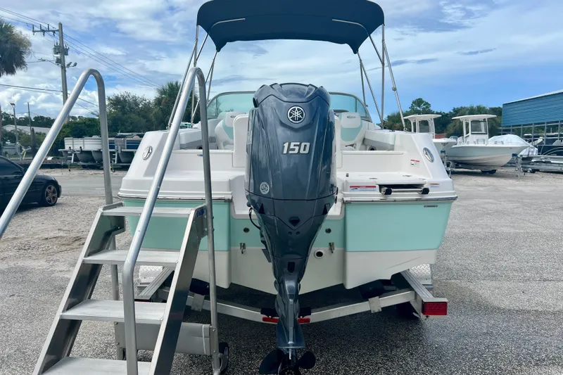 Slide: The Image of 2024 Robalo R207 Dual Console boat with Yamaha 150 engine, parked on trailer. - 6