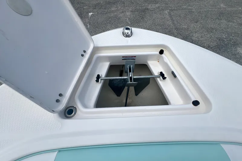 Slide: The Image of Open anchor compartment on 2024 Robalo R207 Dual Console boat. - 17