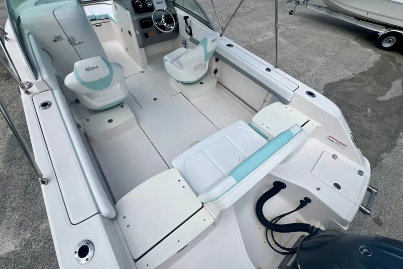 Slide: The Image of 2024 Robalo R207 Dual Console boat interior with seating and steering wheel. - 8