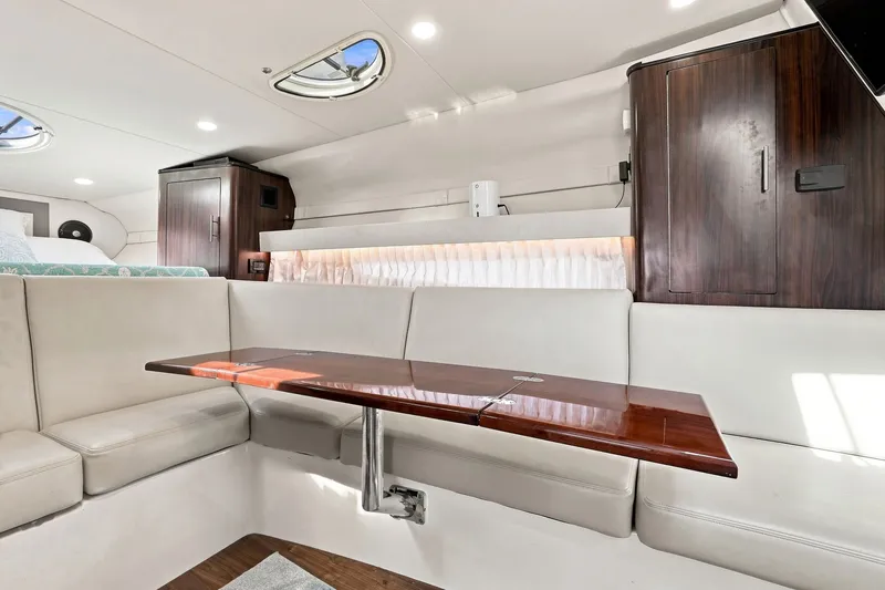 Slide: The Image of Luxurious interior of 2018 Regal 33 XO yacht with elegant seating and wooden table. - 69