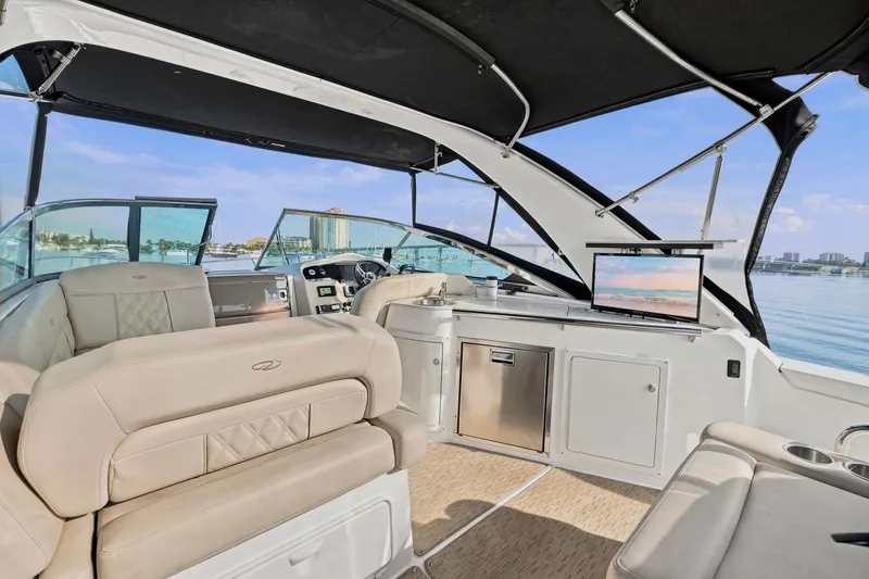 Slide: The Image of Luxurious interior of 2018 Regal 33 XO yacht with plush seating and modern amenities. - 45