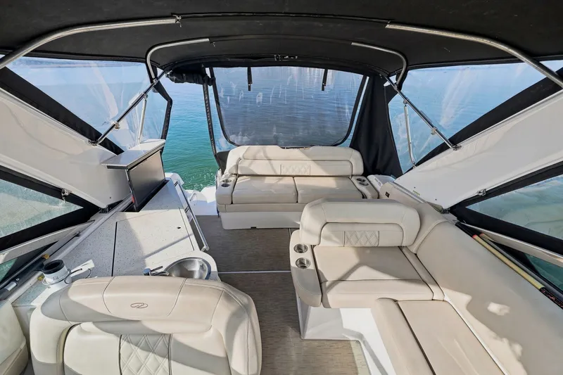Slide: The Image of Luxurious interior of a 2018 Regal 33 XO boat with comfortable seating and scenic water view. - 39