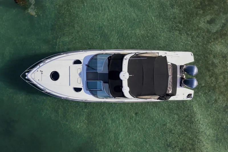 Slide: The Image of Aerial view of 2018 Regal 33 XO boat on clear water. - 2