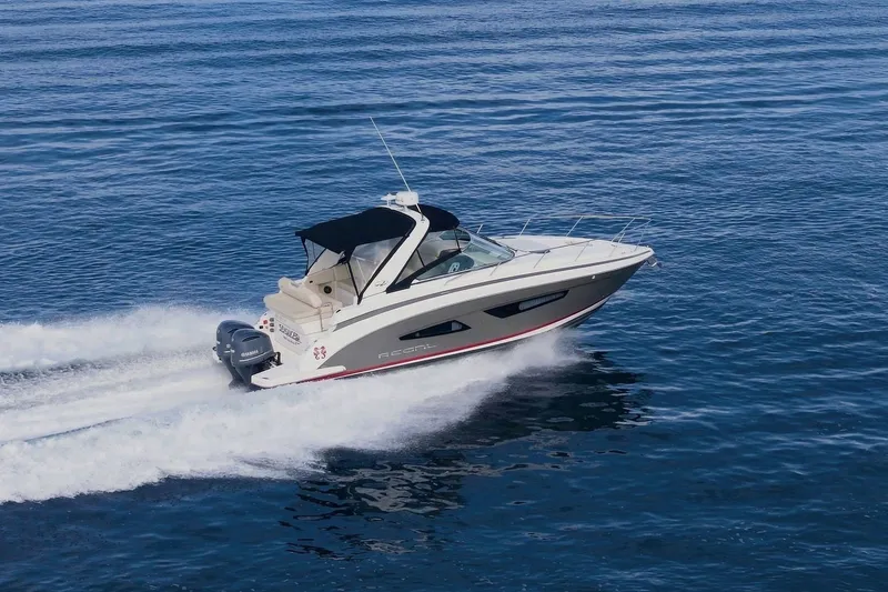 Slide: The Image of 2018 Regal 33 XO boat cruising on open water, showcasing sleek design and powerful performance. - 4