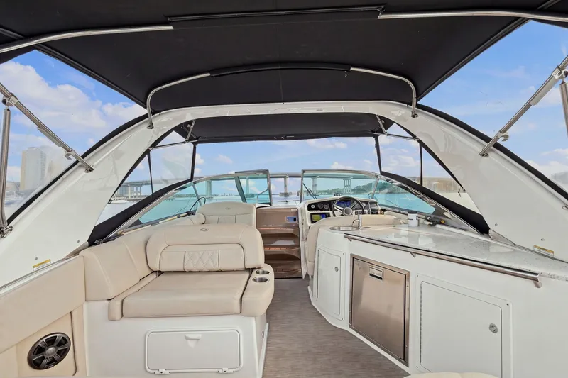 Slide: The Image of Interior view of a 2018 Regal 33 XO yacht with seating and kitchenette. - 37