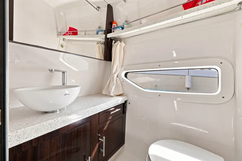 Slide: The Image of Luxurious bathroom interior of 2018 Regal 33 XO yacht with modern fixtures and sleek design. - 74
