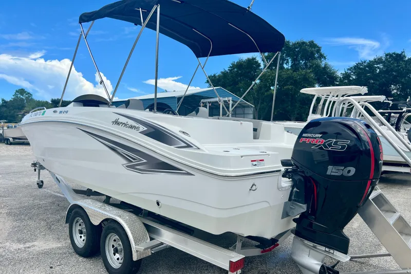 Slide: The Image of 2024 Hurricane Sundeck Sport 218 OB boat with Mercury Pro XS 150 engine on trailer. - 6