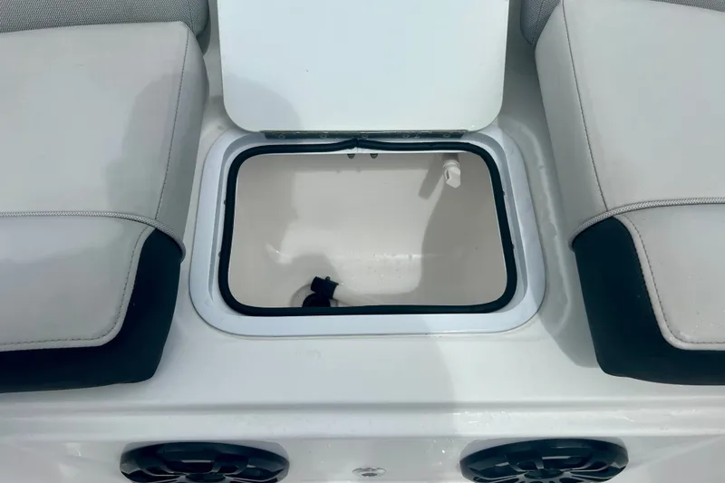 Slide: The Image of 2024 Hurricane Sundeck Sport 218 OB boat storage compartment with cushioned seating. - 18