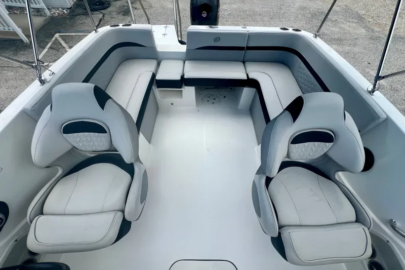 Slide: The Image of 2024 Hurricane Sundeck Sport 218 OB boat interior with plush seating and modern design. - 9