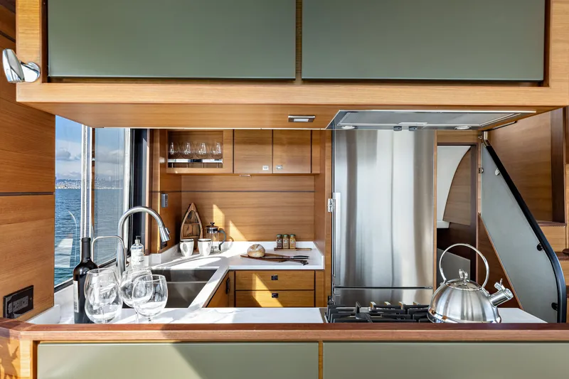 Slide: The Image of Modern kitchen interior of 2024 North Pacific 450 Pilothouse yacht with ocean view. - 5