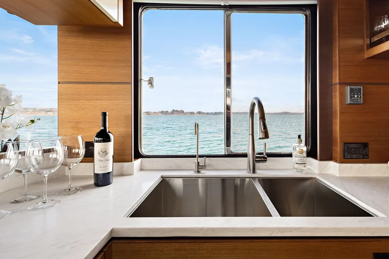 Slide: The Image of Modern kitchen interior of 2024 North Pacific 450 Pilothouse yacht with ocean view. - 7
