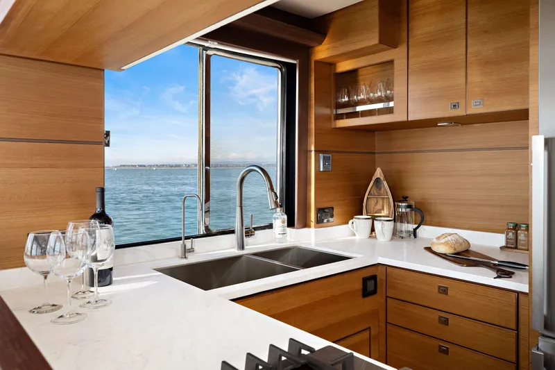 Slide: The Image of Luxurious kitchen in 2024 North Pacific 450 Pilothouse yacht with ocean view. - 6