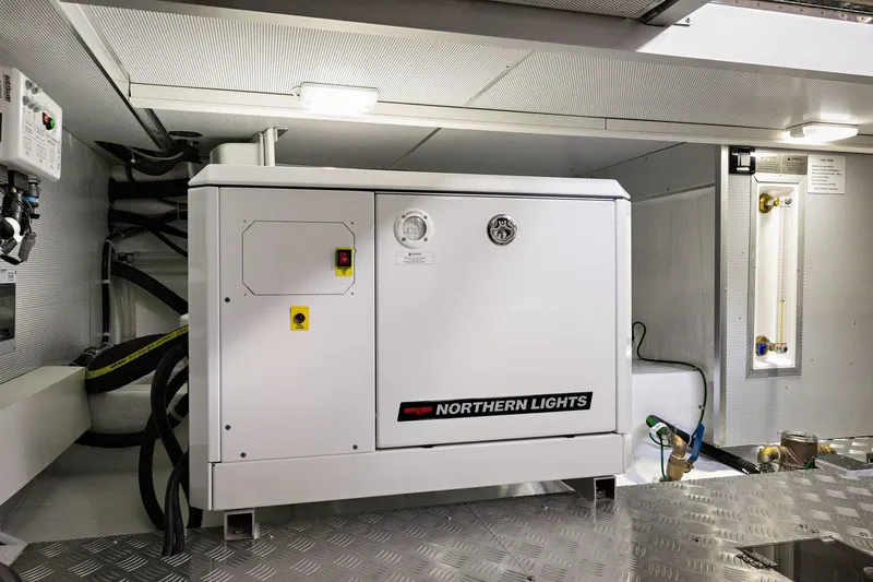 Slide: The Image of Engine room of 2024 North Pacific 450 Pilothouse featuring Northern Lights generator. - 27