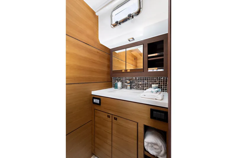 Slide: The Image of Luxurious bathroom in 2024 North Pacific 450 Pilothouse yacht with modern wood finish. - 15