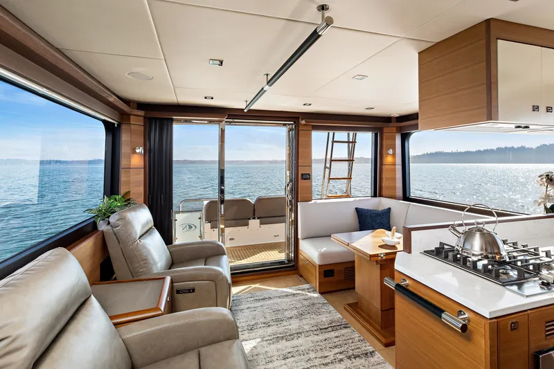 Slide: The Image of Luxurious interior of 2024 North Pacific 450 Pilothouse yacht with ocean view. - 3