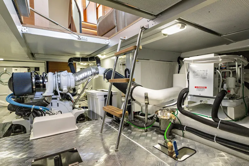 Slide: The Image of Engine room of 2024 North Pacific 450 Pilothouse yacht, showcasing machinery and equipment. - 25