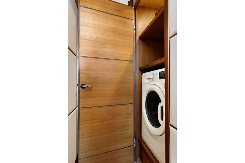 Slide: The Image of Laundry area with washer in 2024 North Pacific 450 Pilothouse yacht. - 19