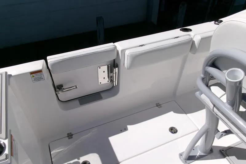 Slide: The Image of 2026 Sea Fox 268 Commander boat interior with white seating and rod holders. - 29