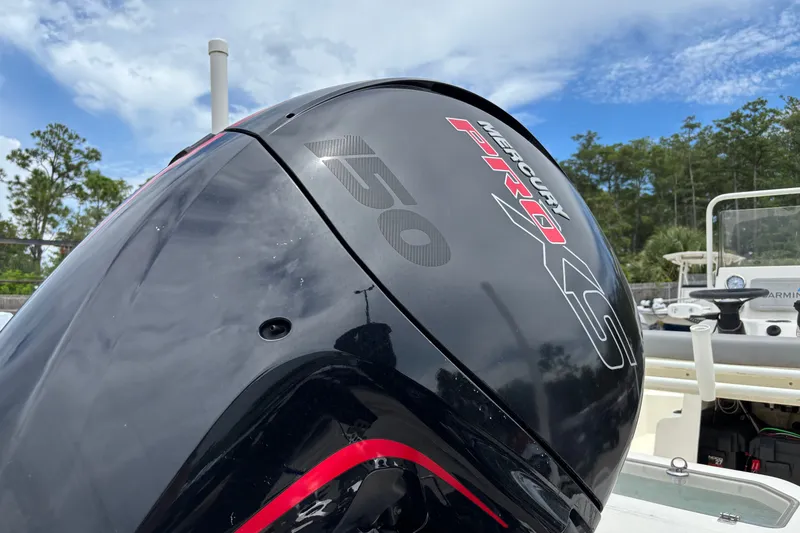 Slide: The Image of Outboard motor on 2023 Mako Pro Skiff 19 CC under blue sky. - 4