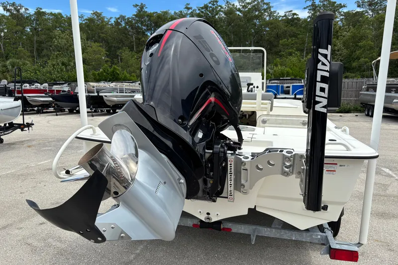 Slide: The Image of 2023 Mako Pro Skiff 19 CC with powerful outboard motor and Talon anchor system. - 3