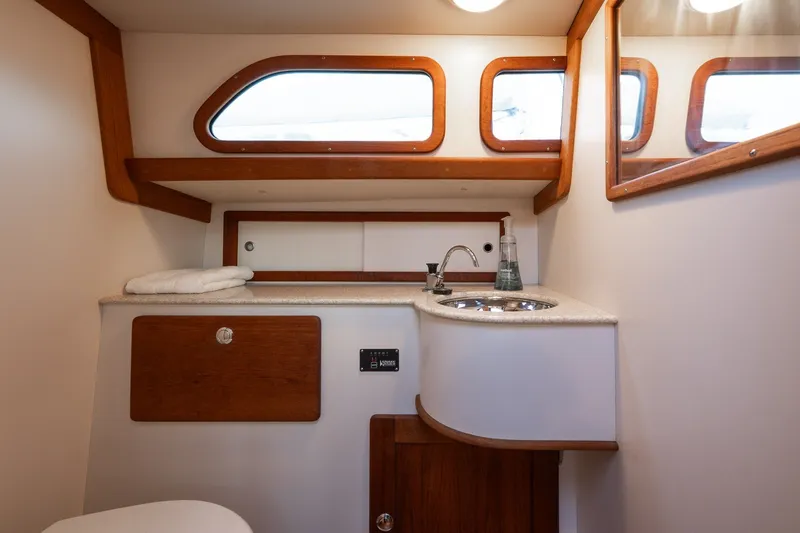 Slide: The Image of Luxurious 2005 Morris M36 yacht bathroom with wooden accents and modern fixtures. - 20