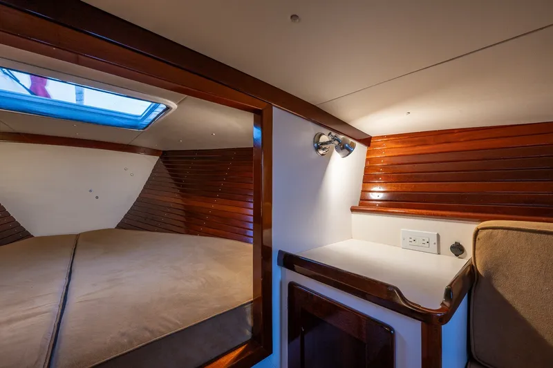 Slide: The Image of Luxurious cabin interior of a 2005 Morris M36 yacht with wood paneling and skylight. - 23