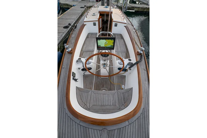 Slide: The Image of Cockpit of a 2005 Morris M36 sailboat with wooden accents and navigation equipment. - 10