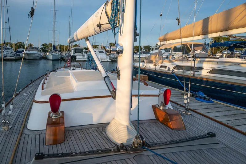 Slide: The Image of Sailboat docked in marina, Morris M36, 2005 model, with wooden deck and rigging. - 7