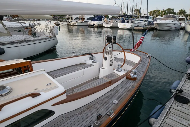 Slide: The Image of Sailboat docked in marina, Morris M36, 2005 model, with American flag. - 5