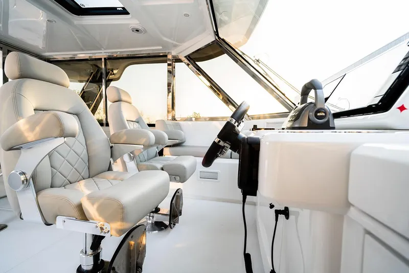 Slide: The Image of Manufacturer Provided Image: Luxurious interior of 2026 Aquila 54 Yacht with plush seating and modern helm. - 6