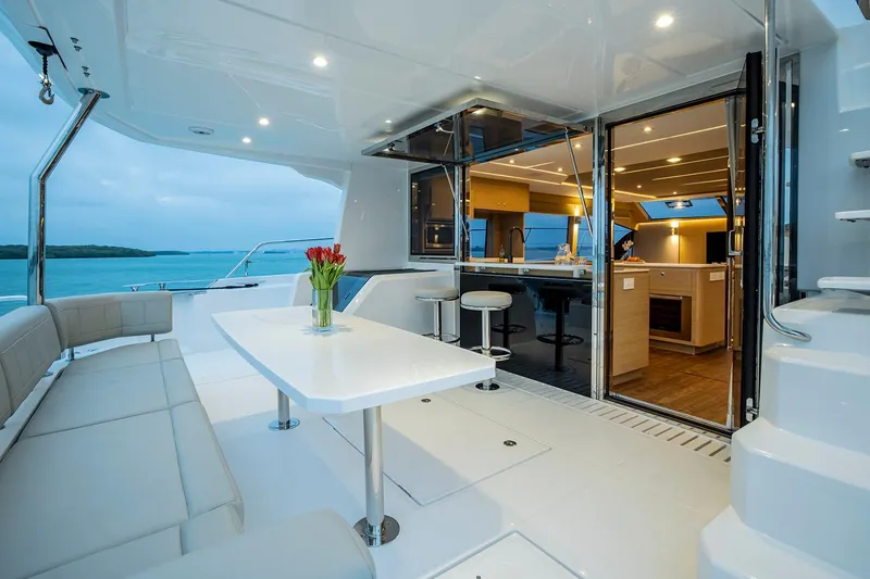Slide: The Image of Manufacturer Provided Image: Luxurious 2026 Aquila 54 Yacht with elegant interior and spacious outdoor seating area. - 5