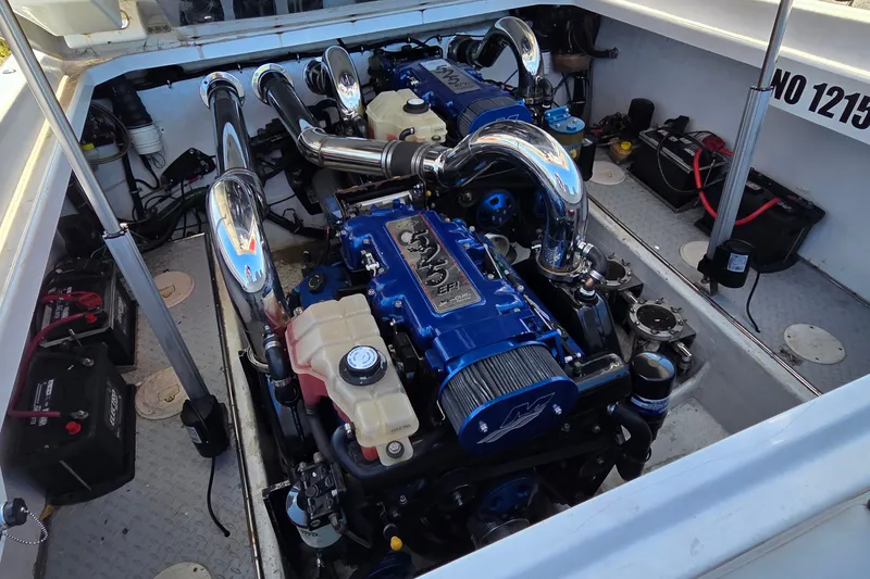 Slide: The Image of Engine compartment of a 2007 Donzi 38 ZR boat, featuring dual high-performance engines. - 20